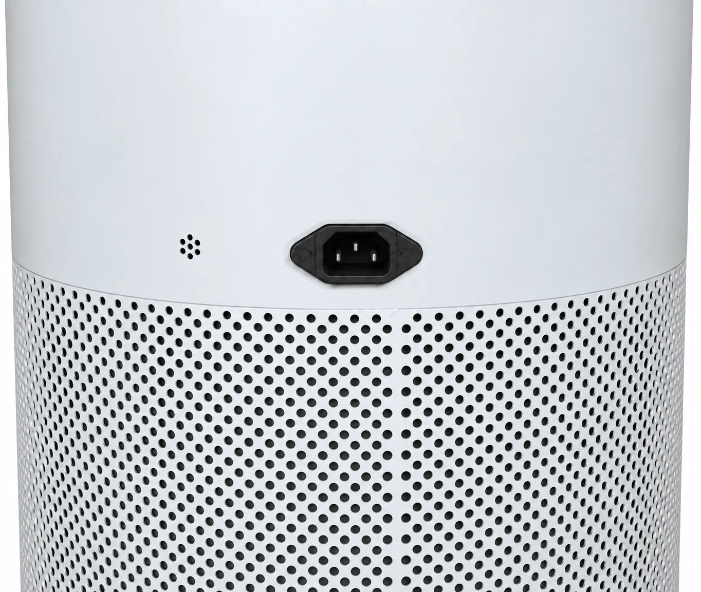 The power inlet on the body of the unit, with the particle sensor window beside it