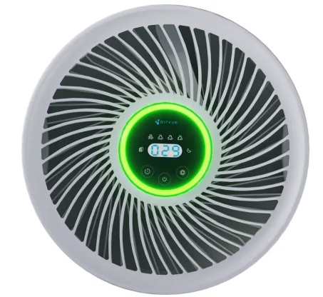 The display sits at the centre of the outlet grille, with the three touch controls on the front rim. The ring around the display changes colour with air quality.